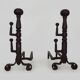 Large pair of wrought iron fireplace andirons. France, 19th century.