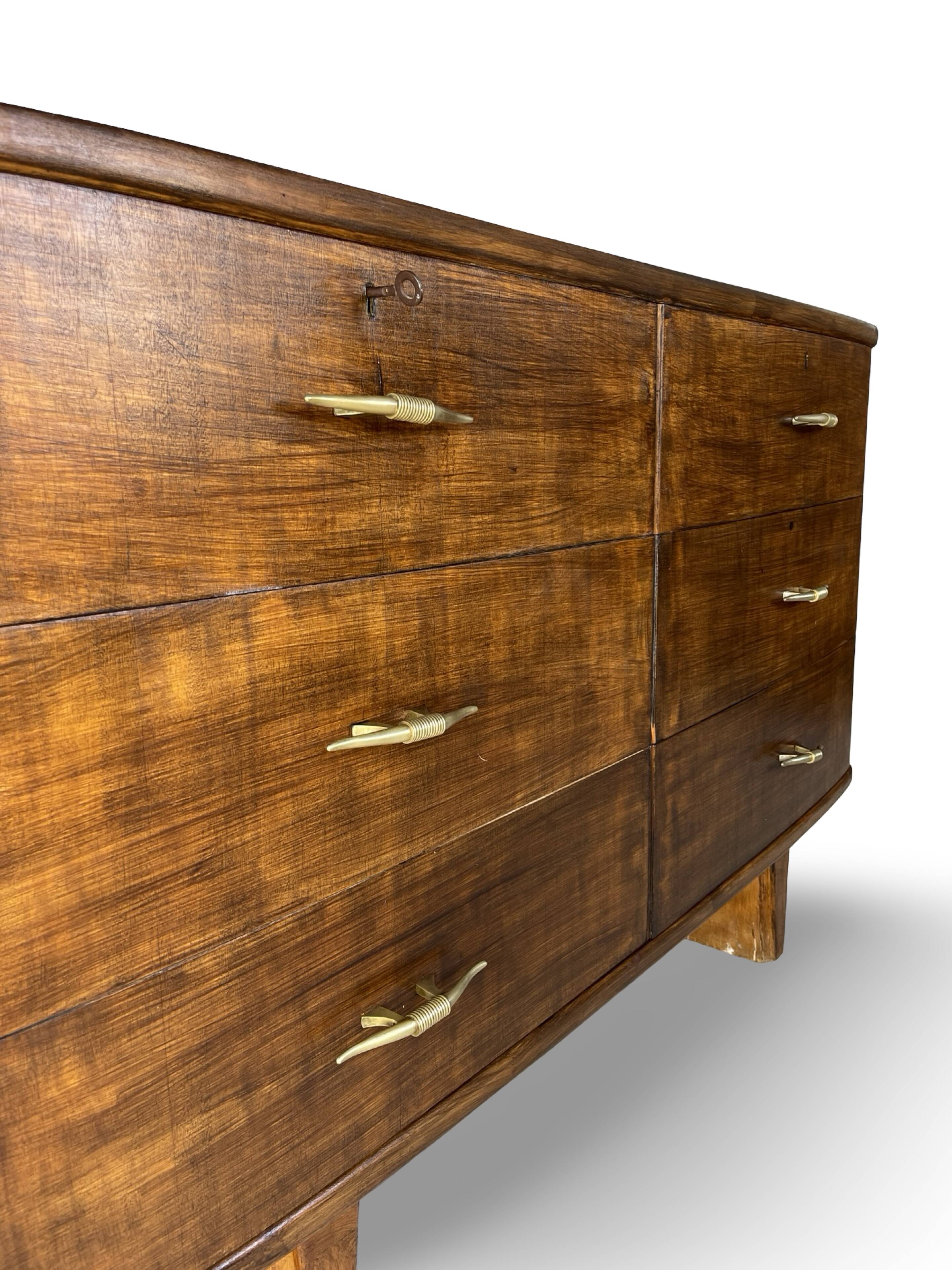 A vintage Italian chest of drawers, made of veneered walnut and solid wood,