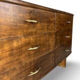A vintage Italian chest of drawers, made of veneered walnut and solid wood,
