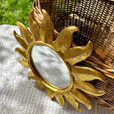 Golden resin sun mirror from the 1960s.
