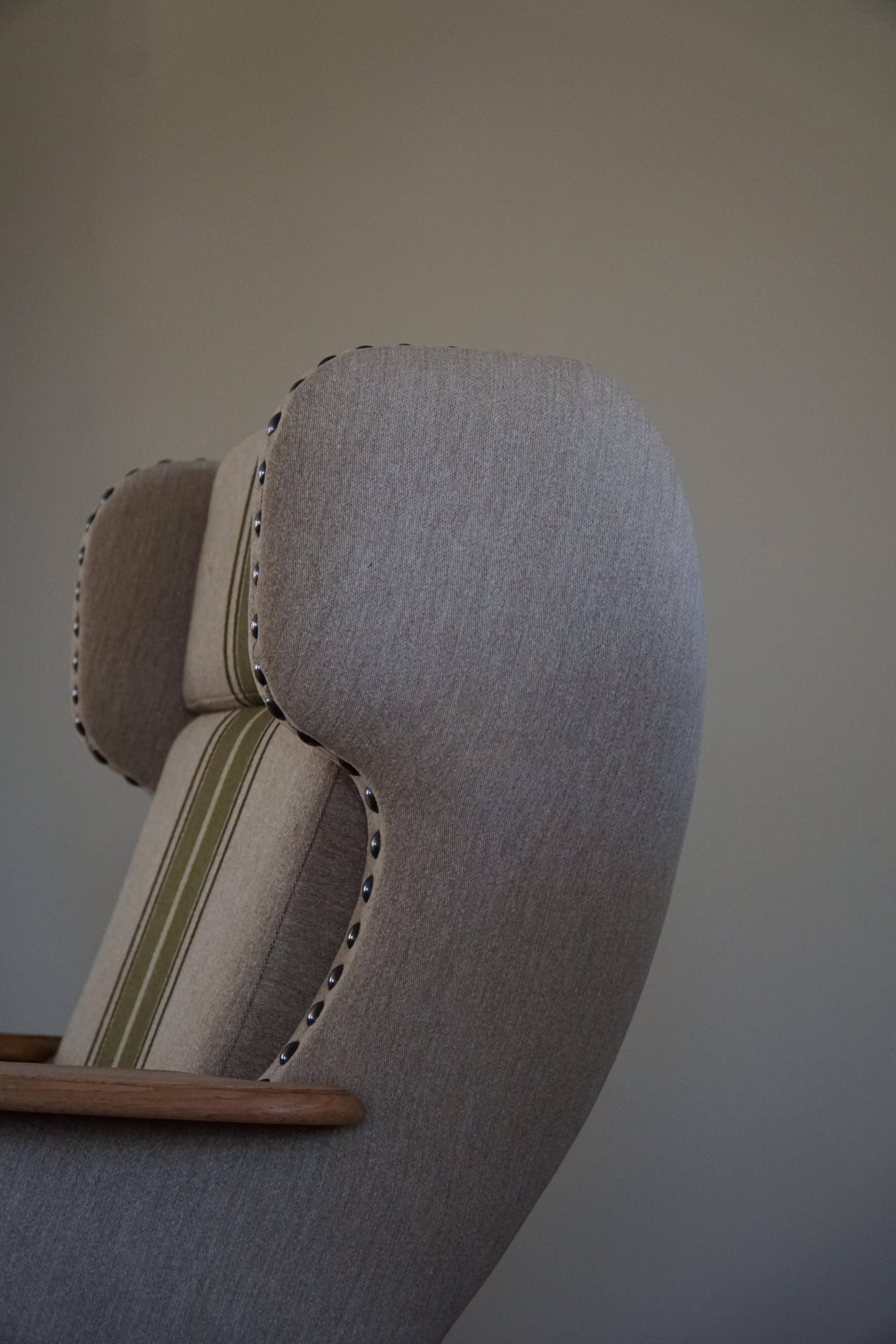 Pair of high-back lounge chairs in modern Danish style in the manner of Henning Kjærnulf, 1960s.