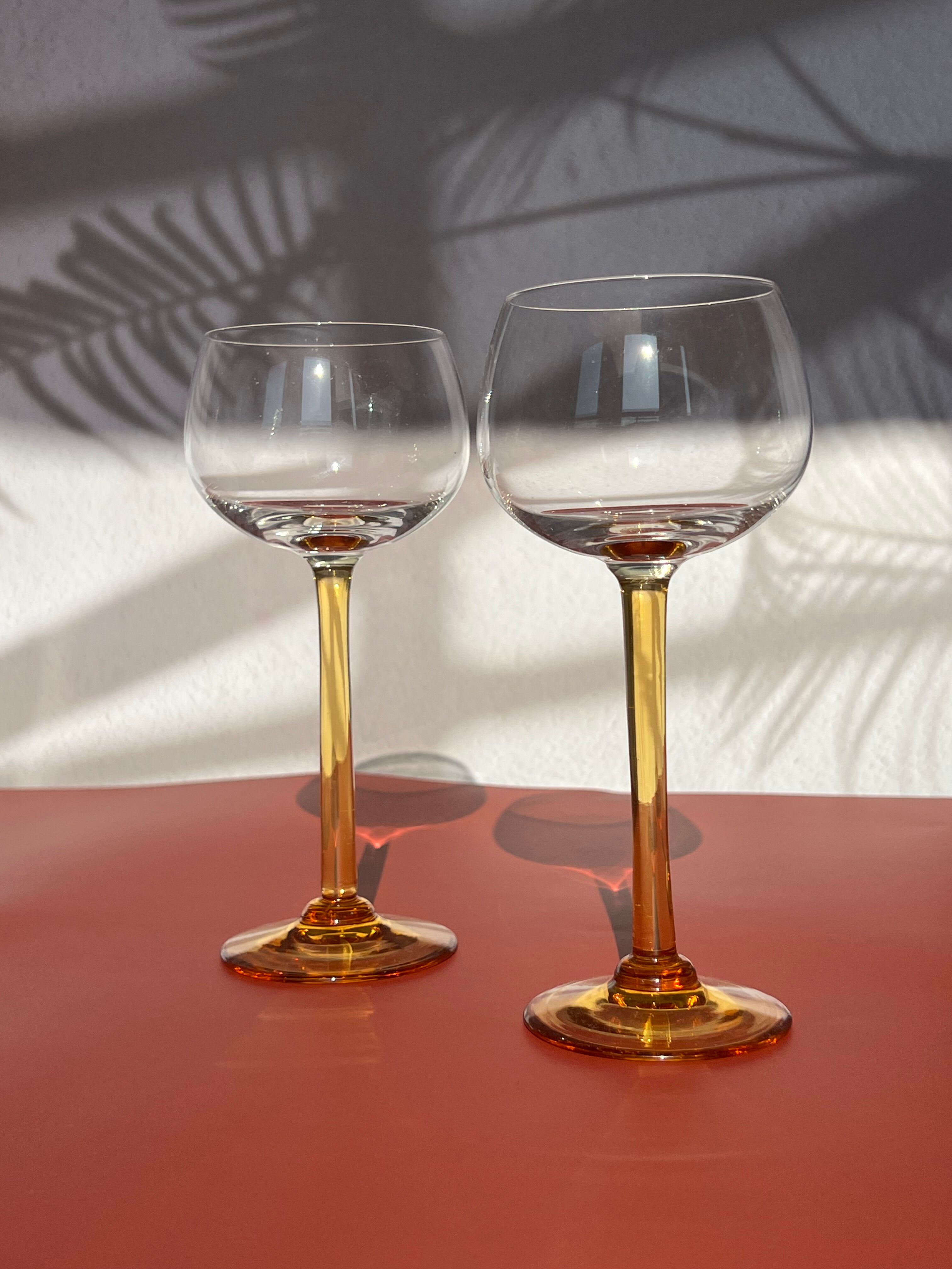 Pair of glass balloon vintage style Luminarc foot rod orange