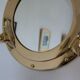 Miroir doré hublot