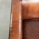 Sleek sheepskin Art Deco design armchair with black piping
