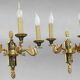 Pair of gold bronze wall lights in Empire style with three lights "Lucien Gau"