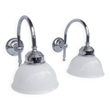 Swan neck and white glass wall lights