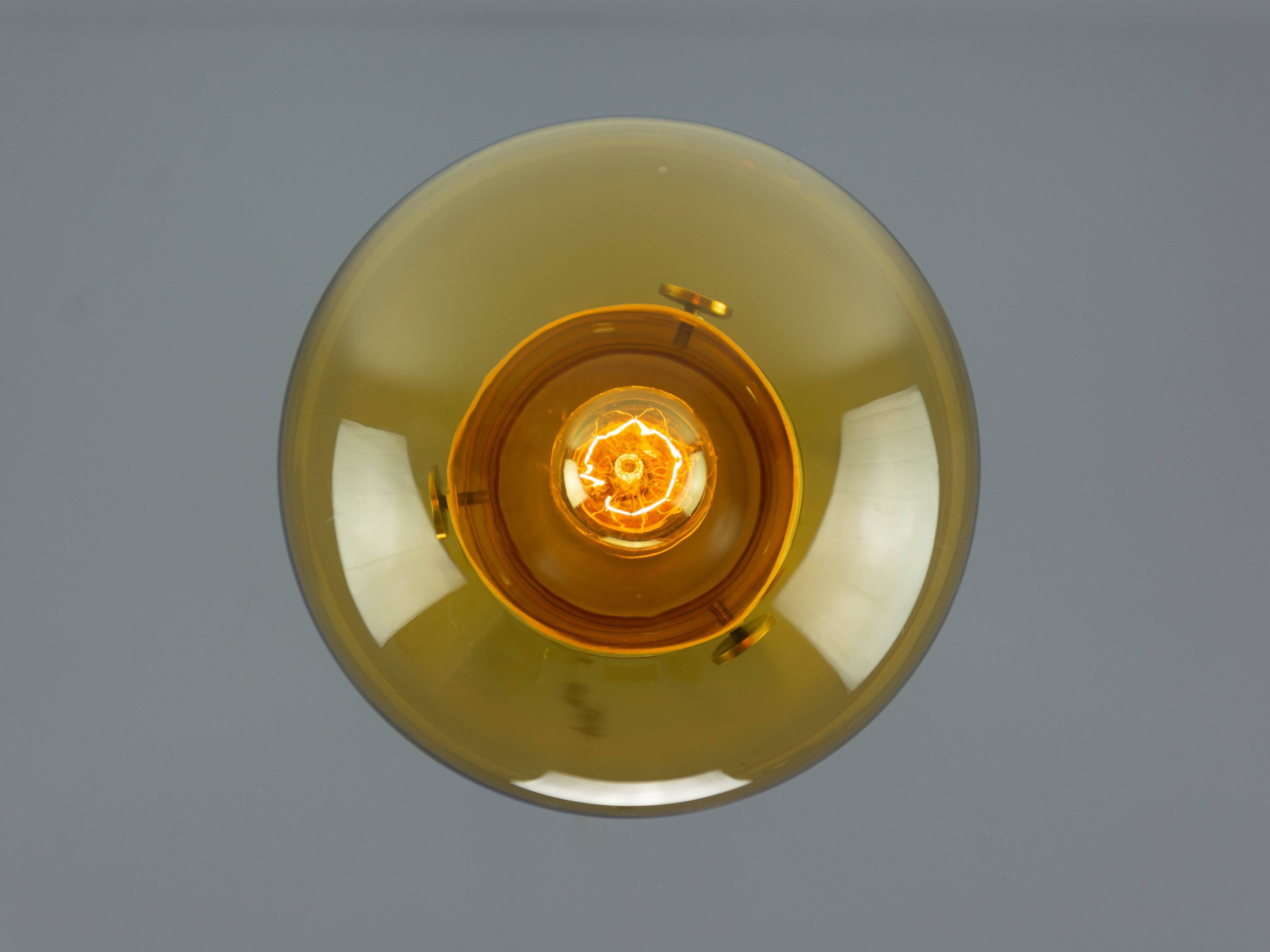 Vintage Mid-Century Modern Industrial Amber Glass And Brass Metal Lamp