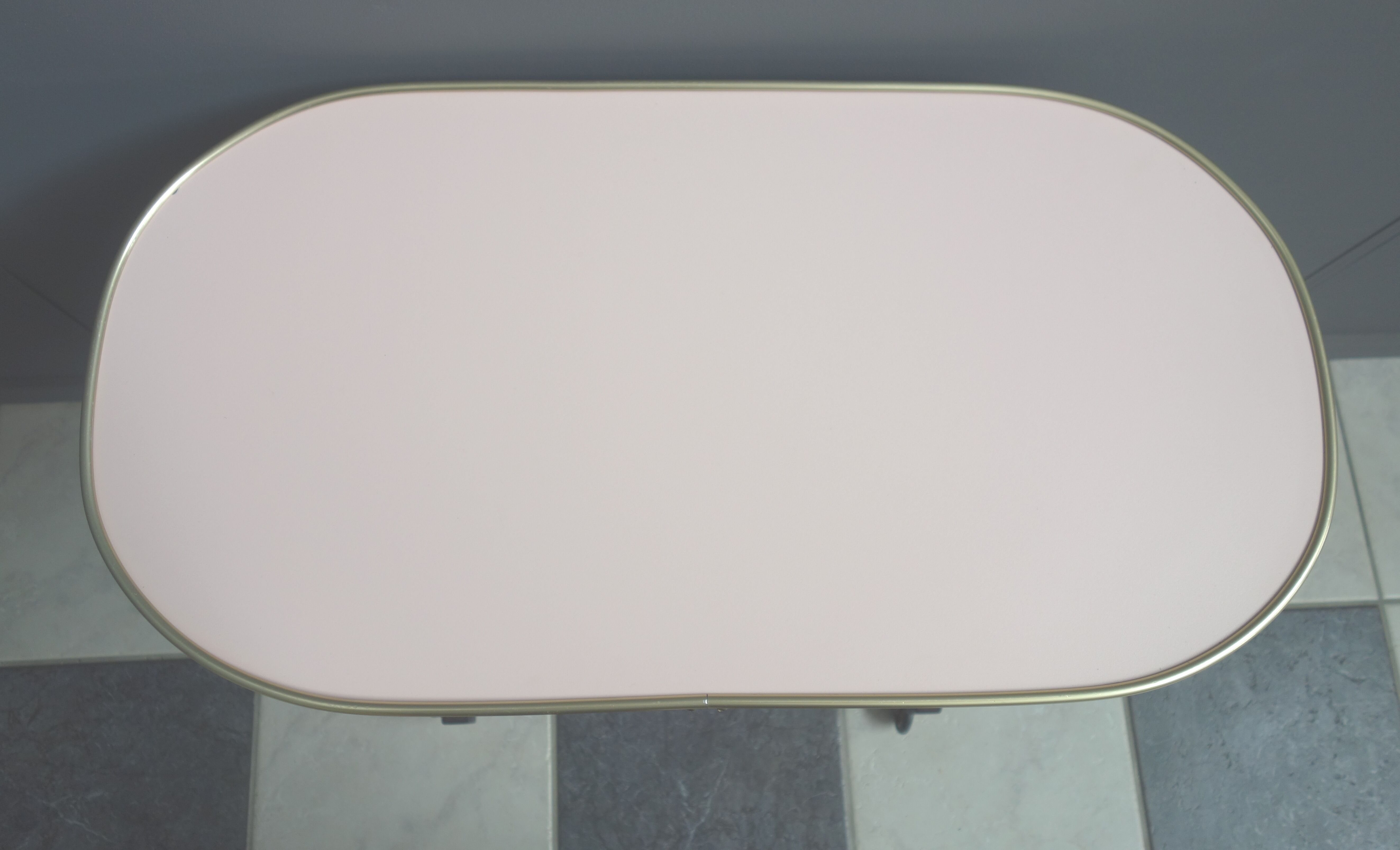 Pink formica magazine table 1950s