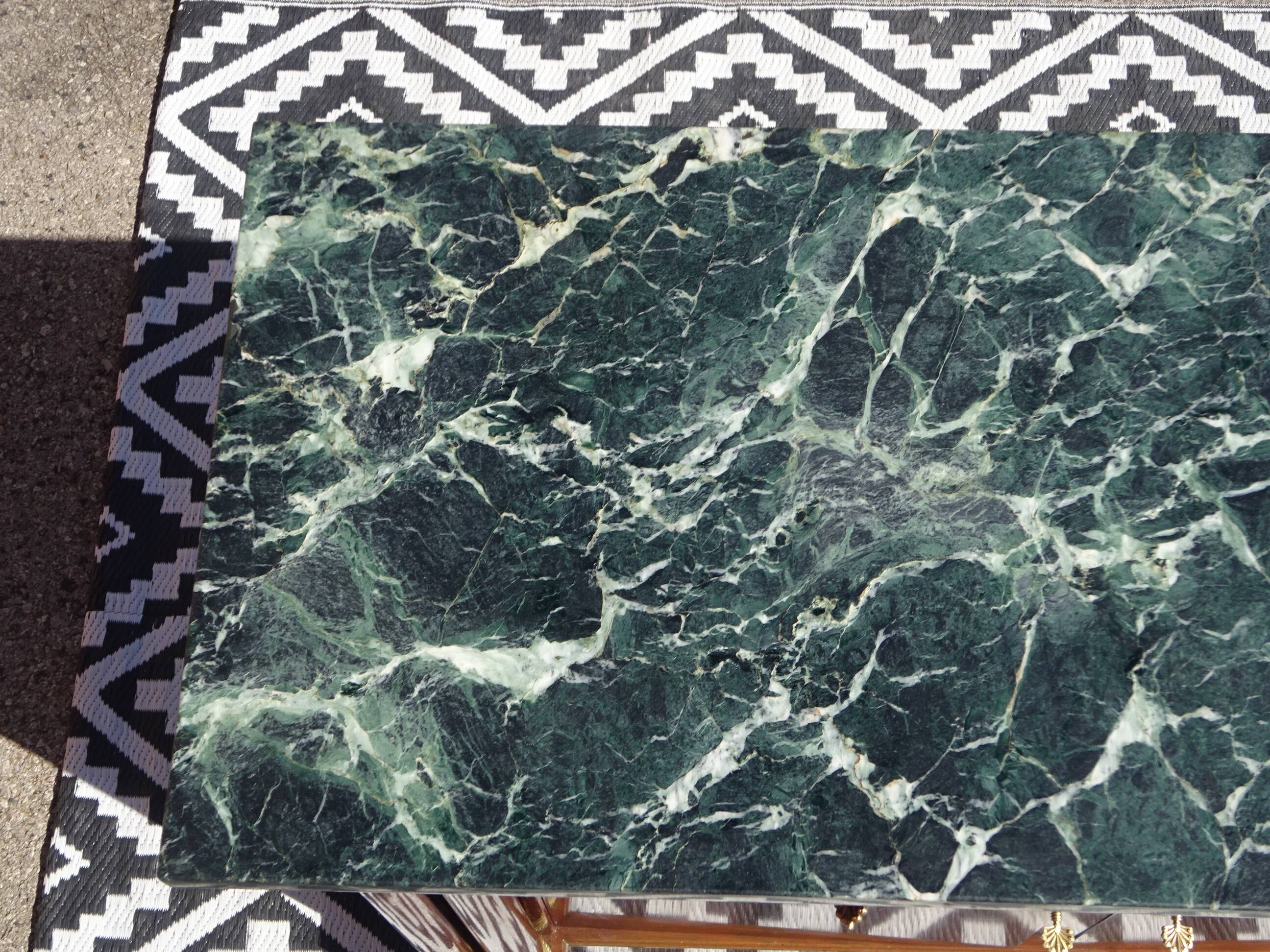 Flamed mahogany enfilade with sea green marble in Empire style.