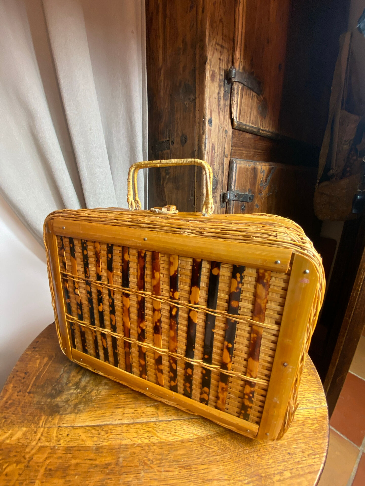 Wicker and wood suitcase