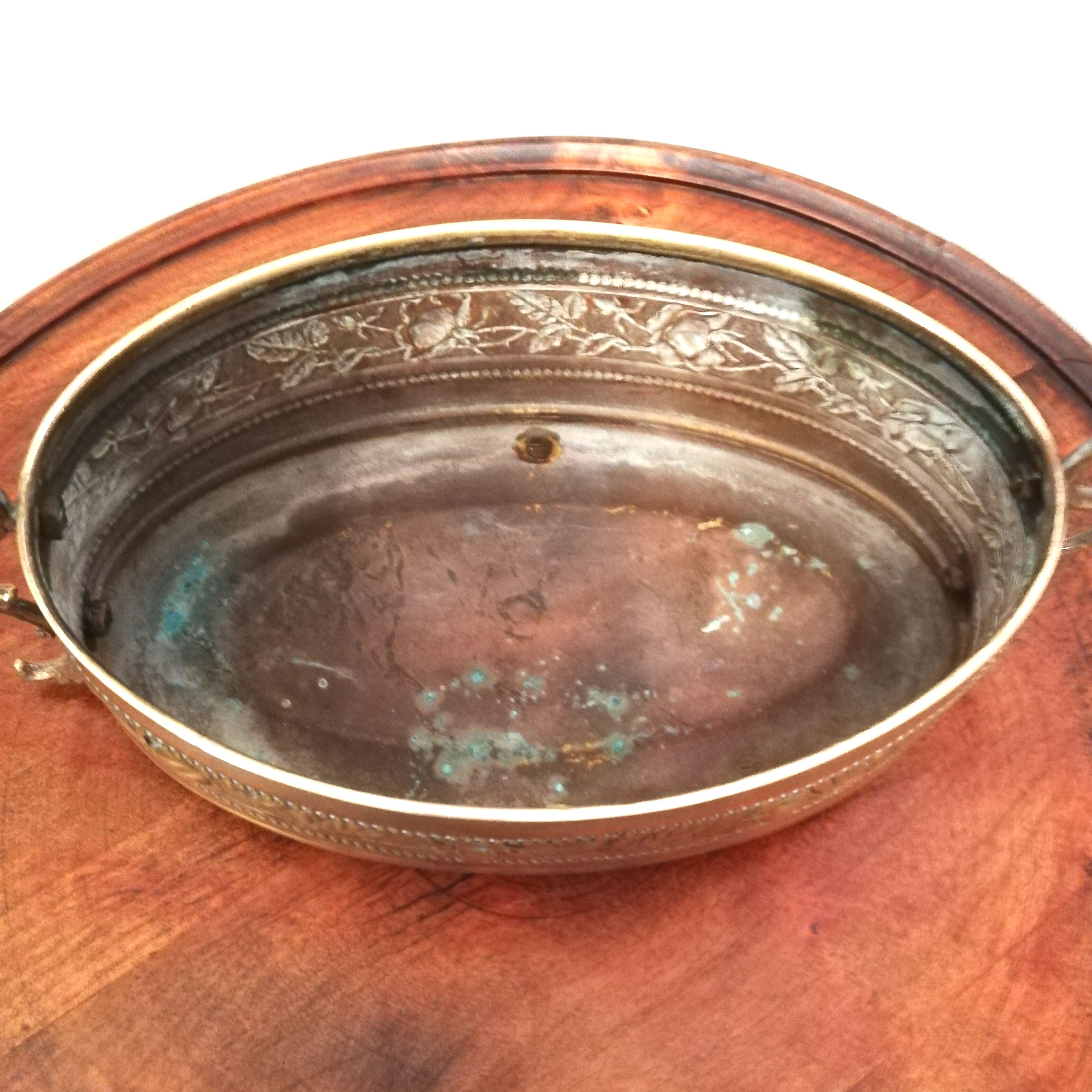 Repulsed brass planter with dragon-shaped handles