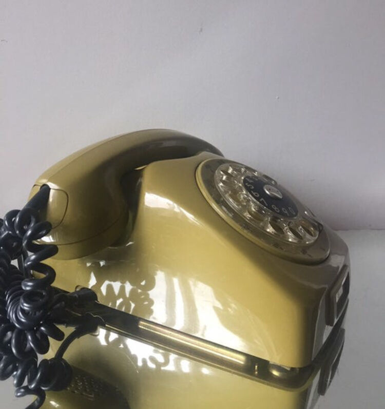 Vintage mustard green rotary telephone