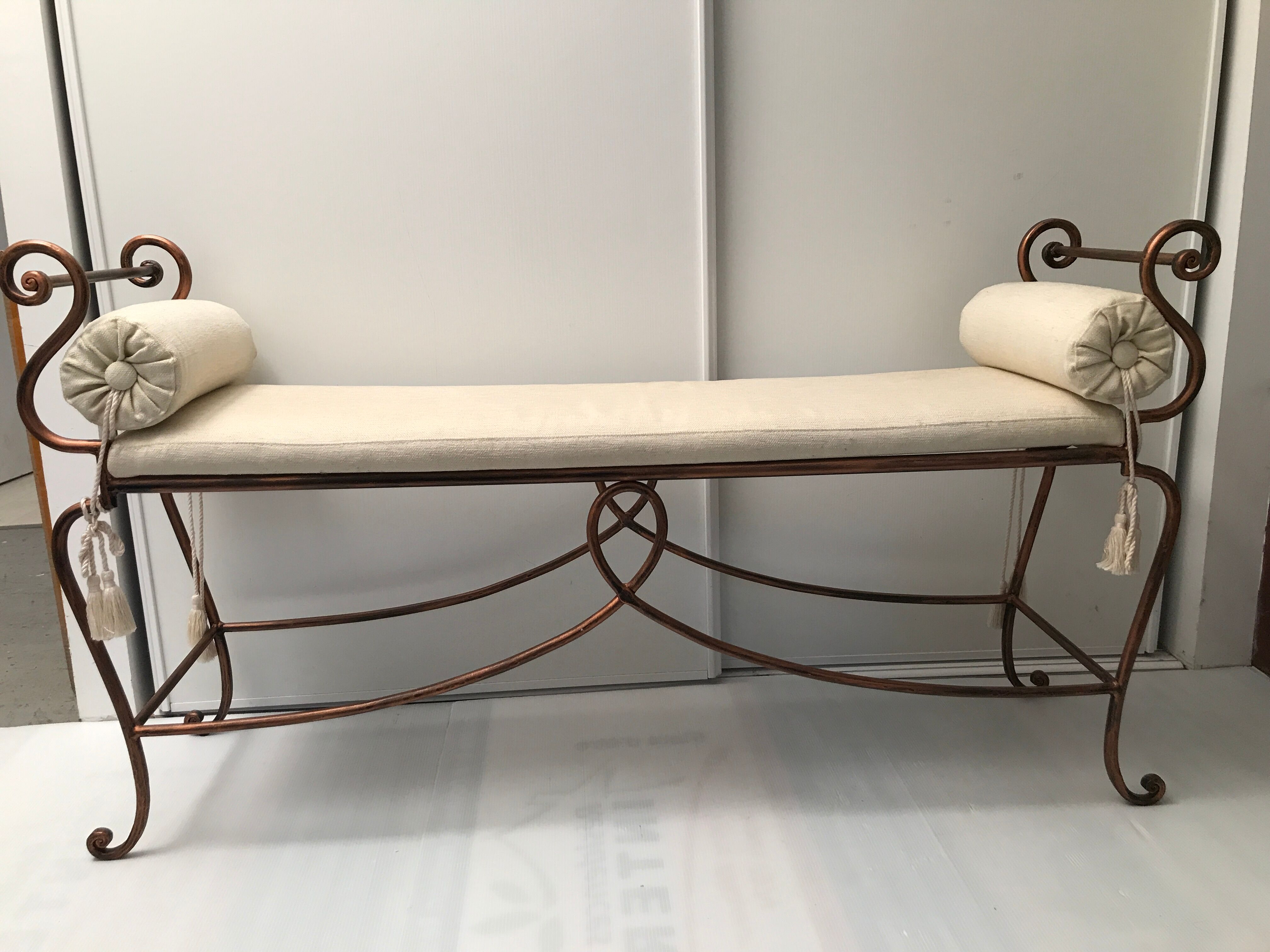 Copper wrought iron bench with cushions