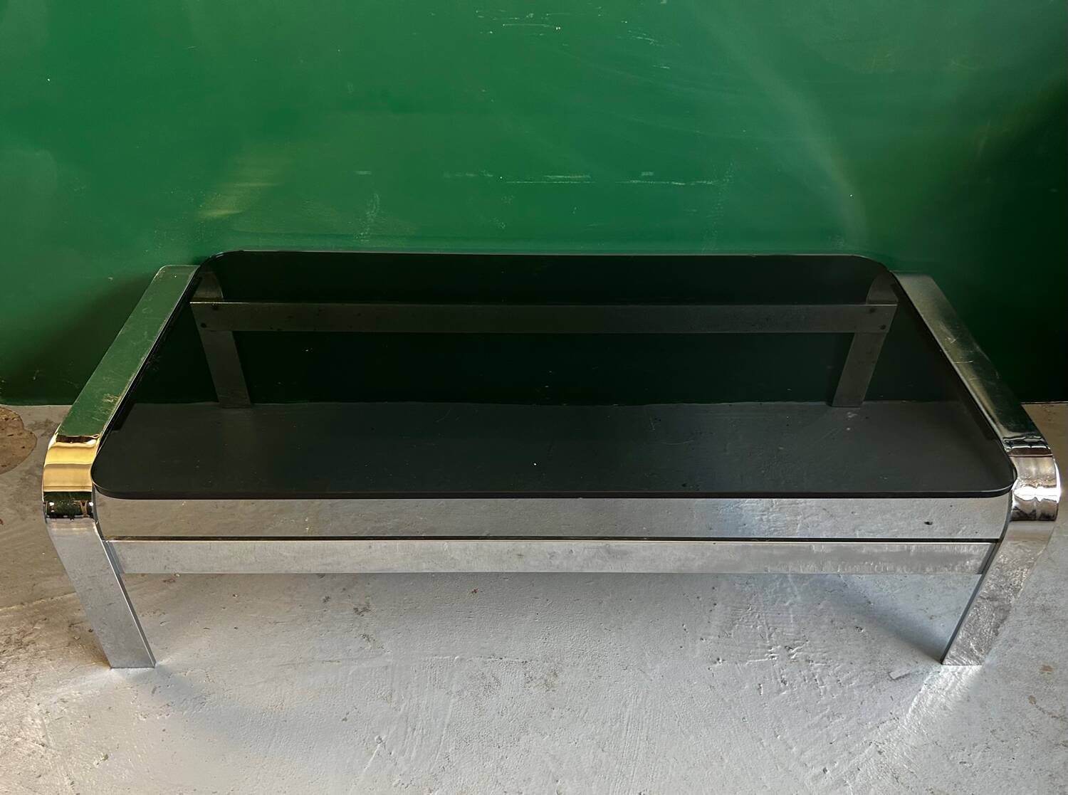 Coffee table in chromed metal and smoked glass
