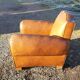 Fauteuil club des années 30 en simili cuir