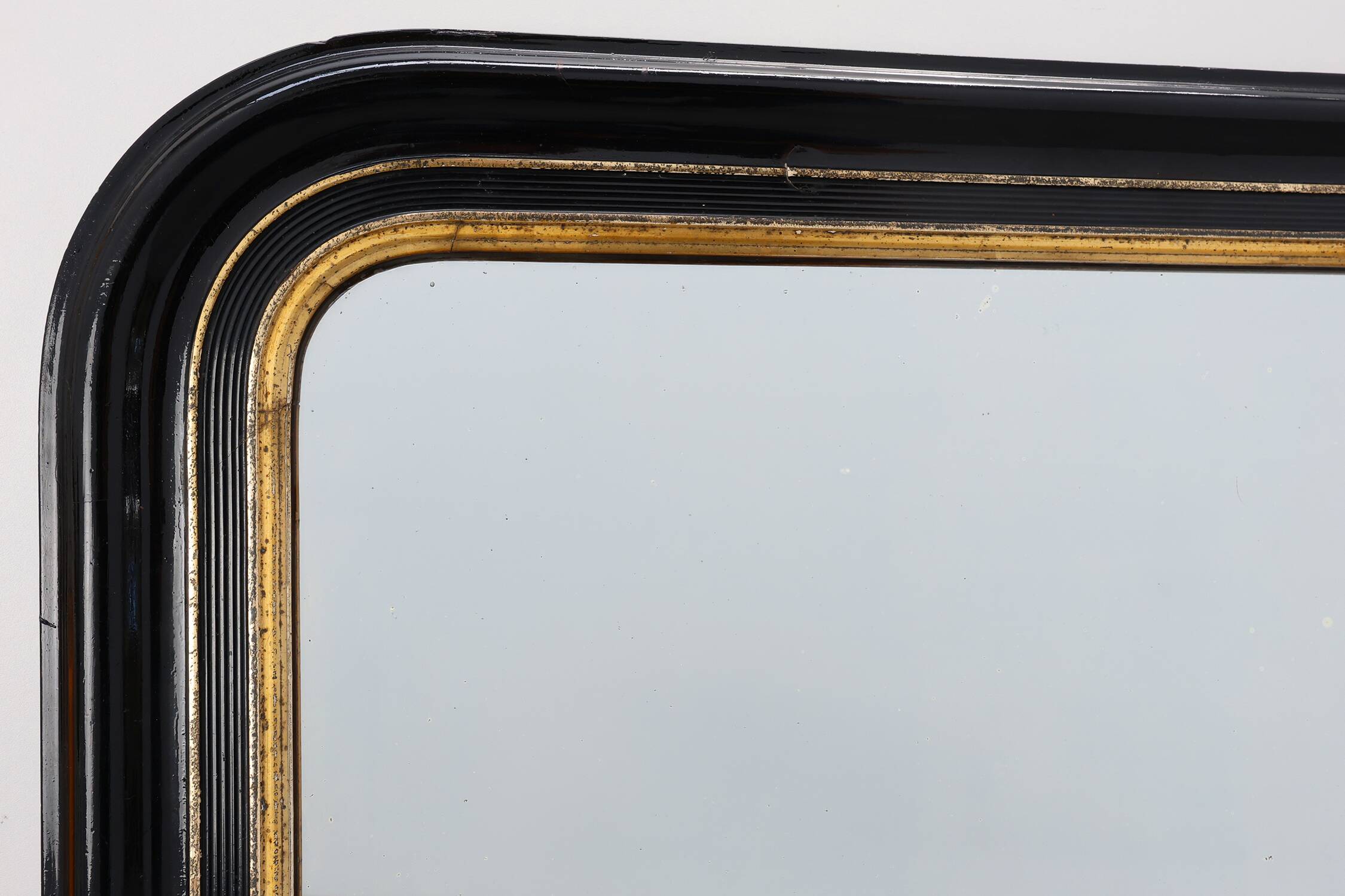 Black laquered and gilted wooden Louis Philippe mirror, France ca. 1850