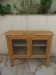 Art Deco sideboard in raw wood with a wax finish, closed by 2 glass doors.