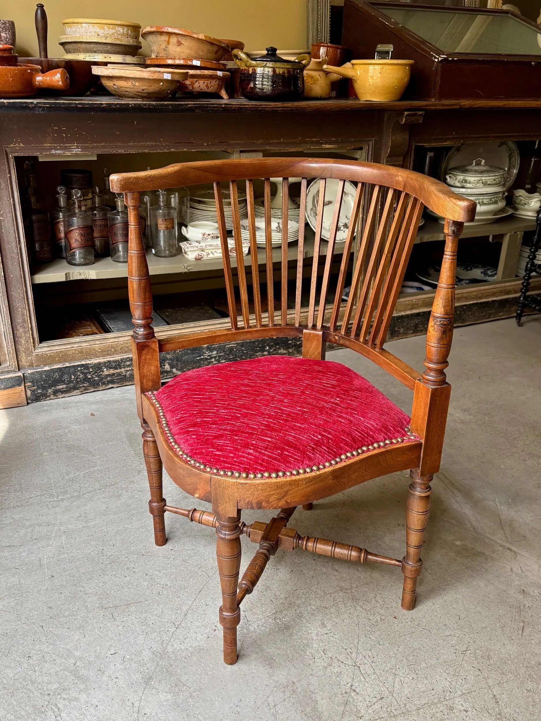 Corner armchair, dark wood and red velvet office chair.