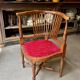 Corner armchair, dark wood and red velvet office chair.
