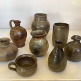 Eight brown ceramic pitcher vases