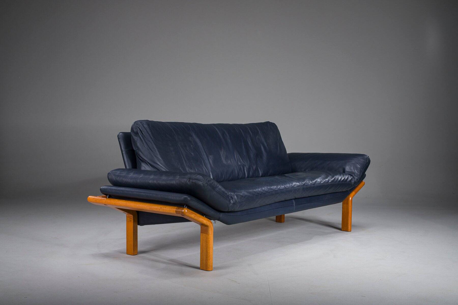 Danish teak and navy blue leather 3-seater sofa from Komfort, 1970s