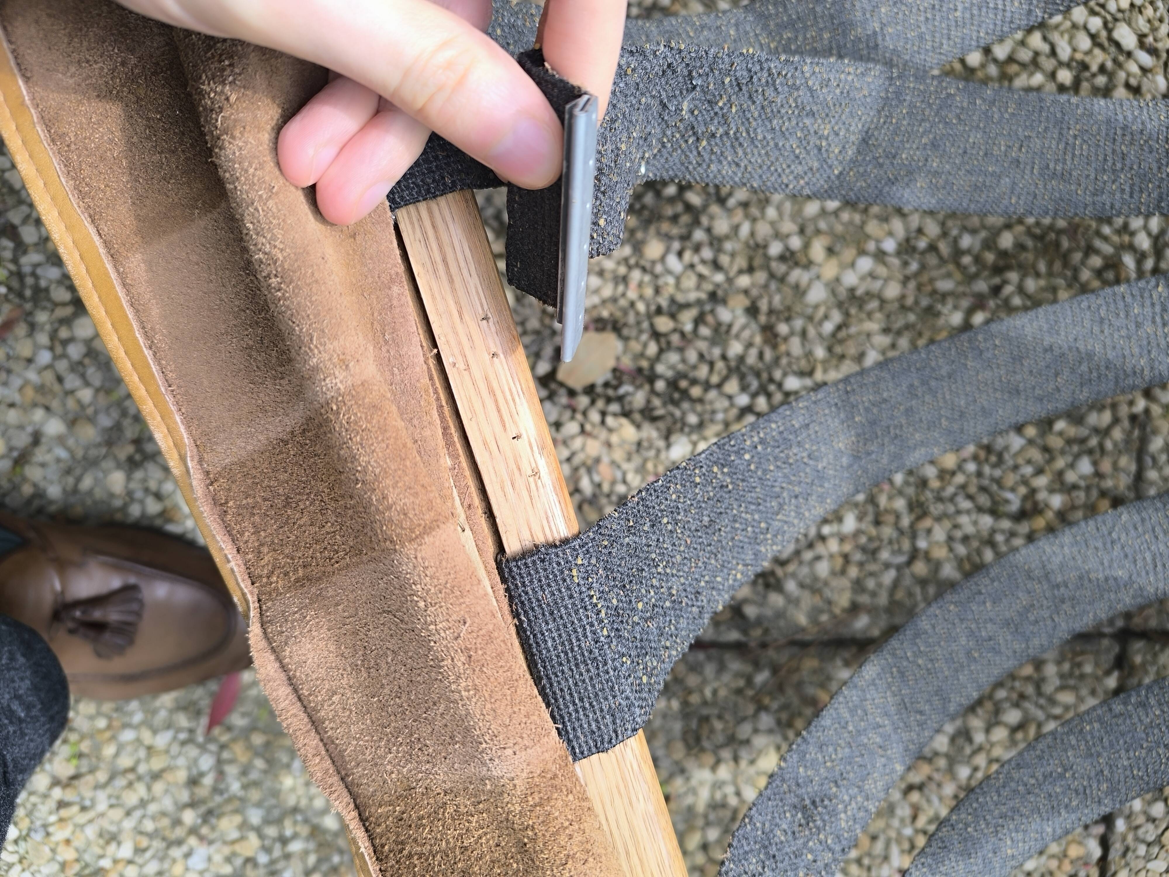 Pair of solid wood and leather lounge chairs, European work, circa 1970.
