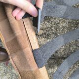 Pair of solid wood and leather lounge chairs, European work, circa 1970.