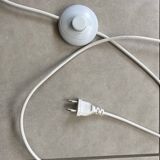 white lacquered metal reading lamp
