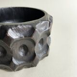 Brutalist wooden pocket emptier