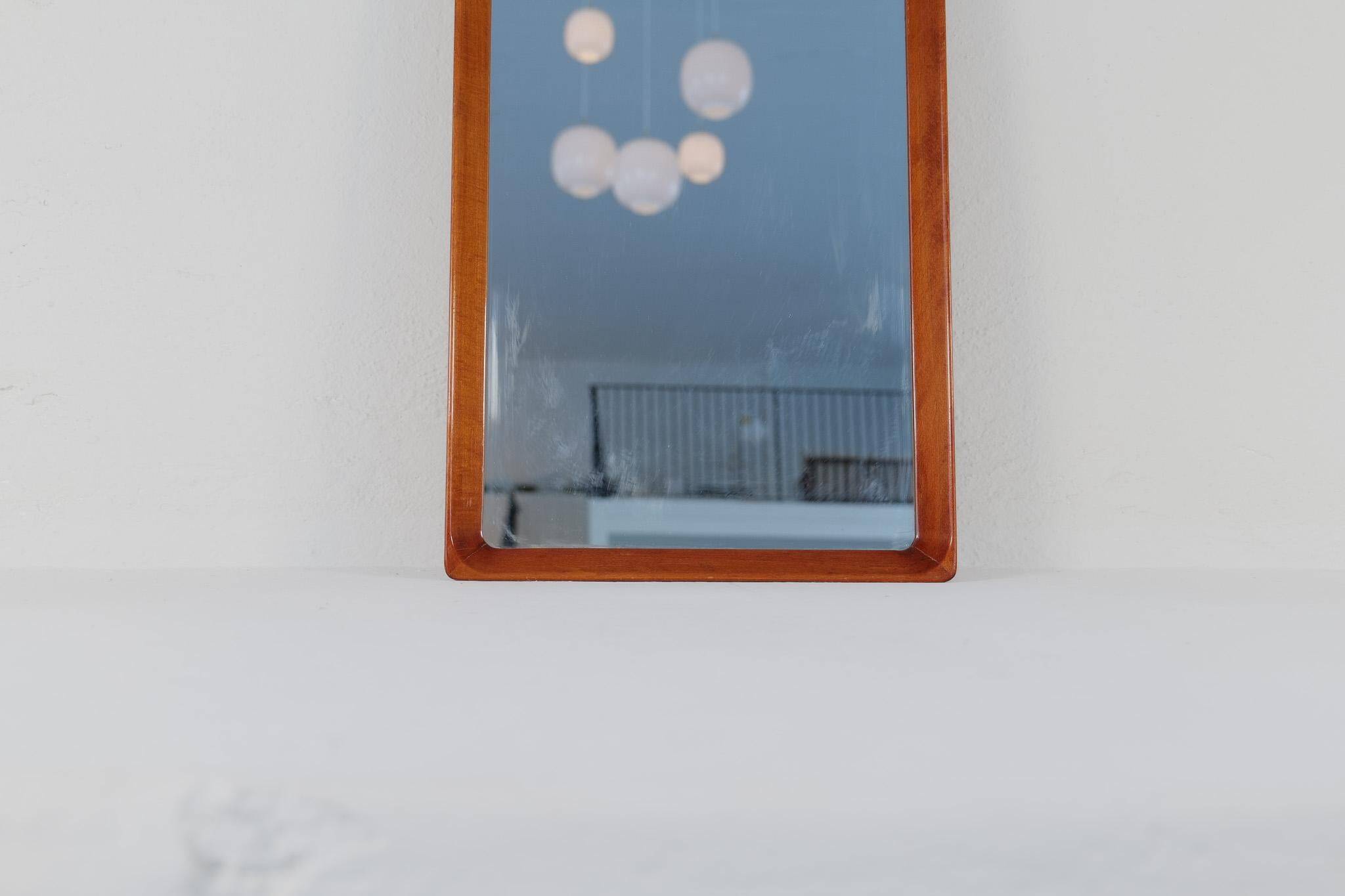 Modern Swedish mirror in mahogany from the 1940s.