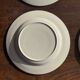 Set of 4 small dessert plates with a vintage stylised flower pattern.