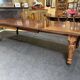 Victorian-style mahogany English table with 3 extensions.