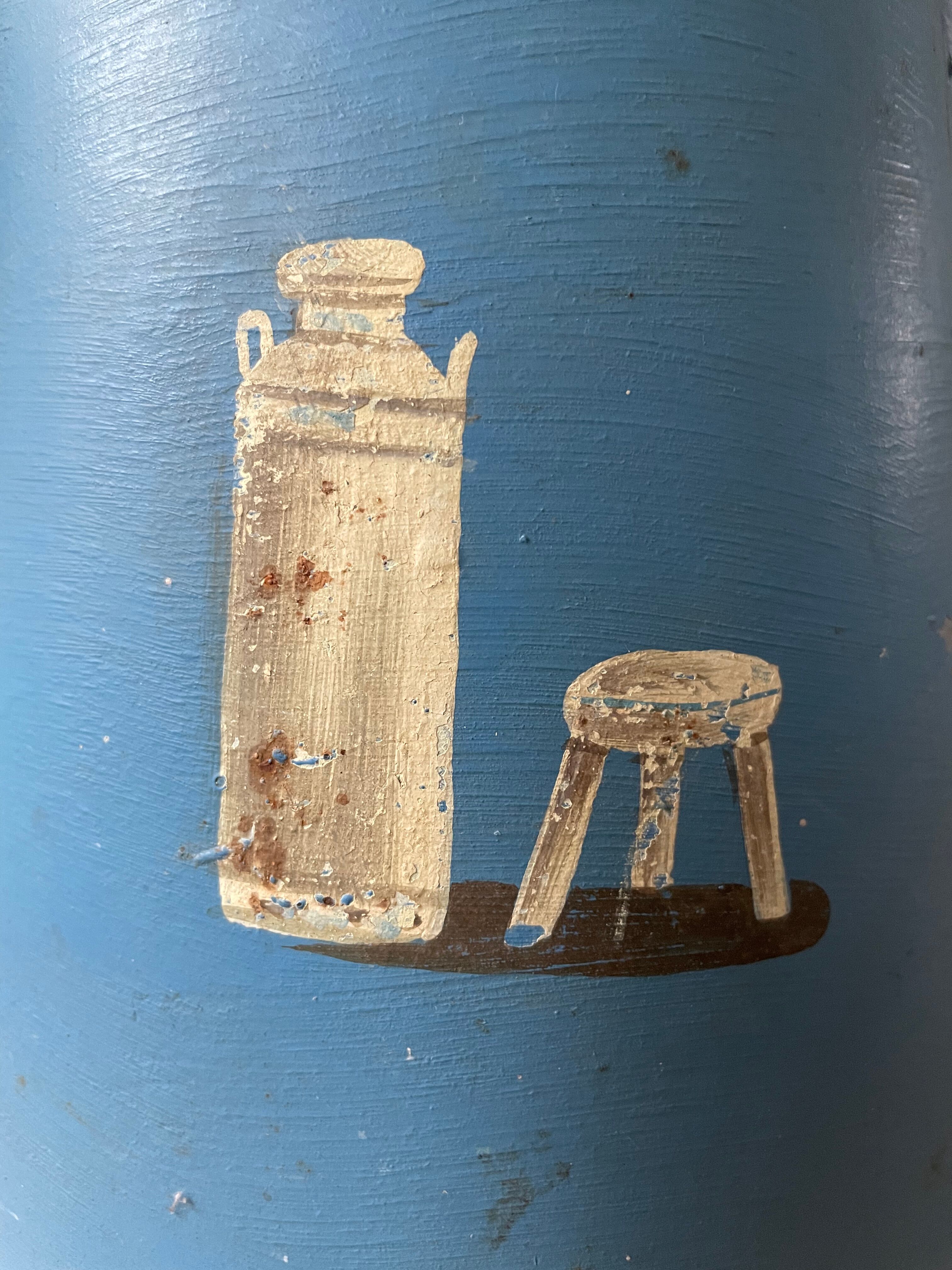 Old painted sheet metal jug or milk jug