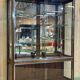Early 20th-century shop display cabinet in oak with sliding doors.