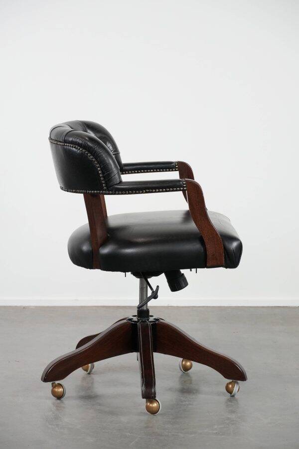 Adjustable black timeless Chesterfield office chair made of cow leather