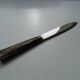 12 vintage Pradel cheese knives horn and stainless steel handles in case