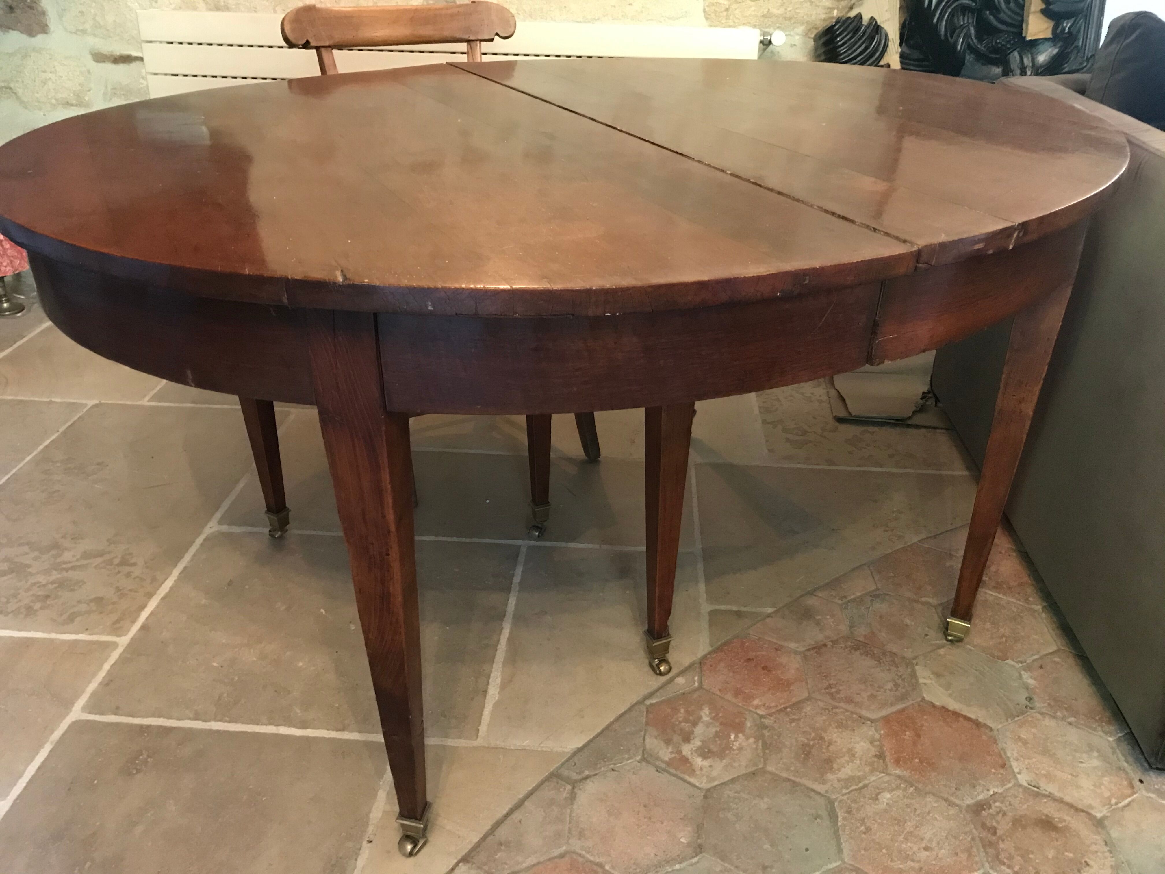 Solid oak table with 3 extension cords, 6 oak chairs with straw seat