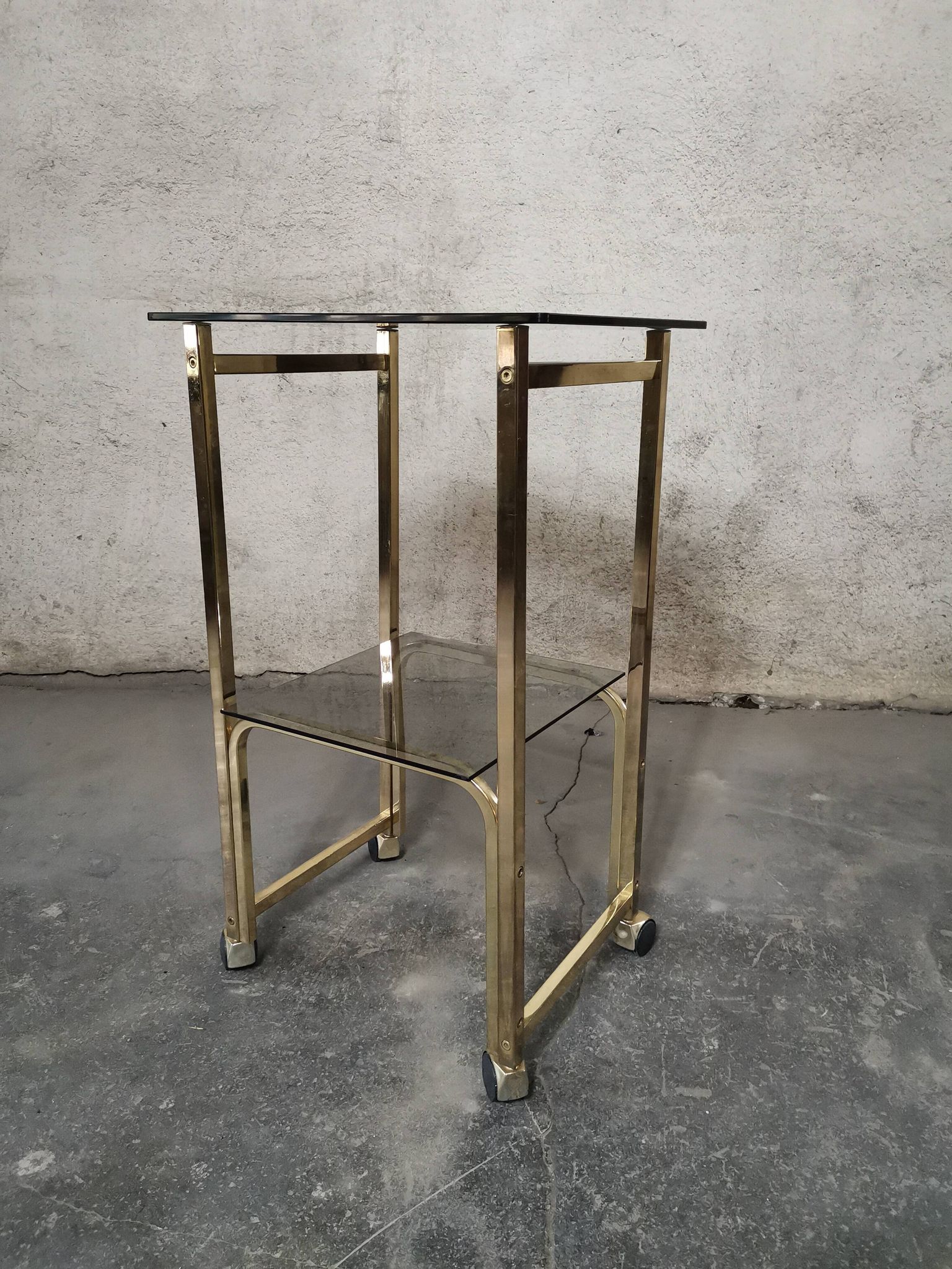 Side Table 1970s smoked glass/gold/wheels