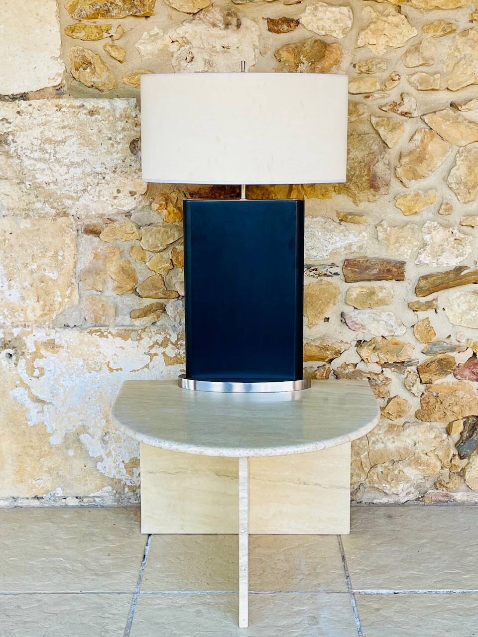 Vintage side table in travertine, circa 1980s.