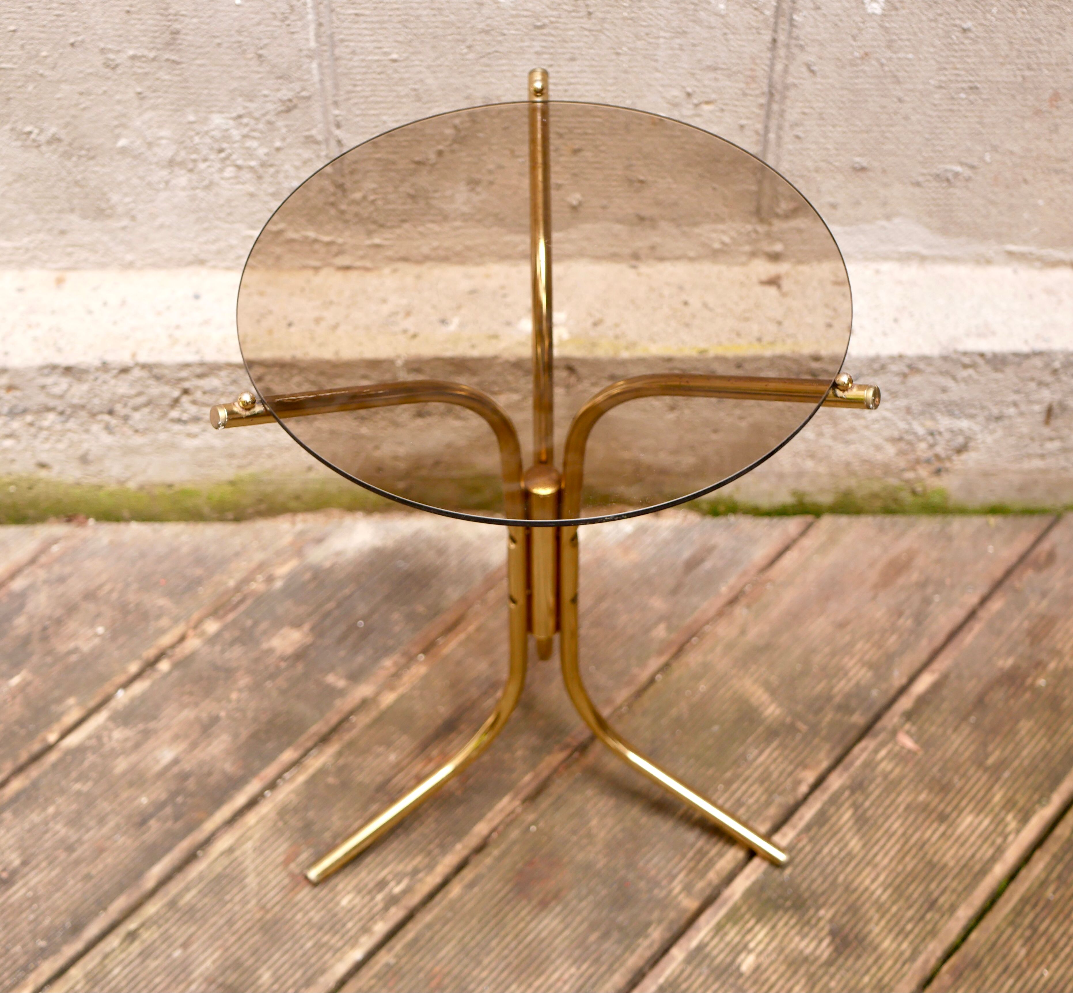 Golden pedestal table in smoked glass