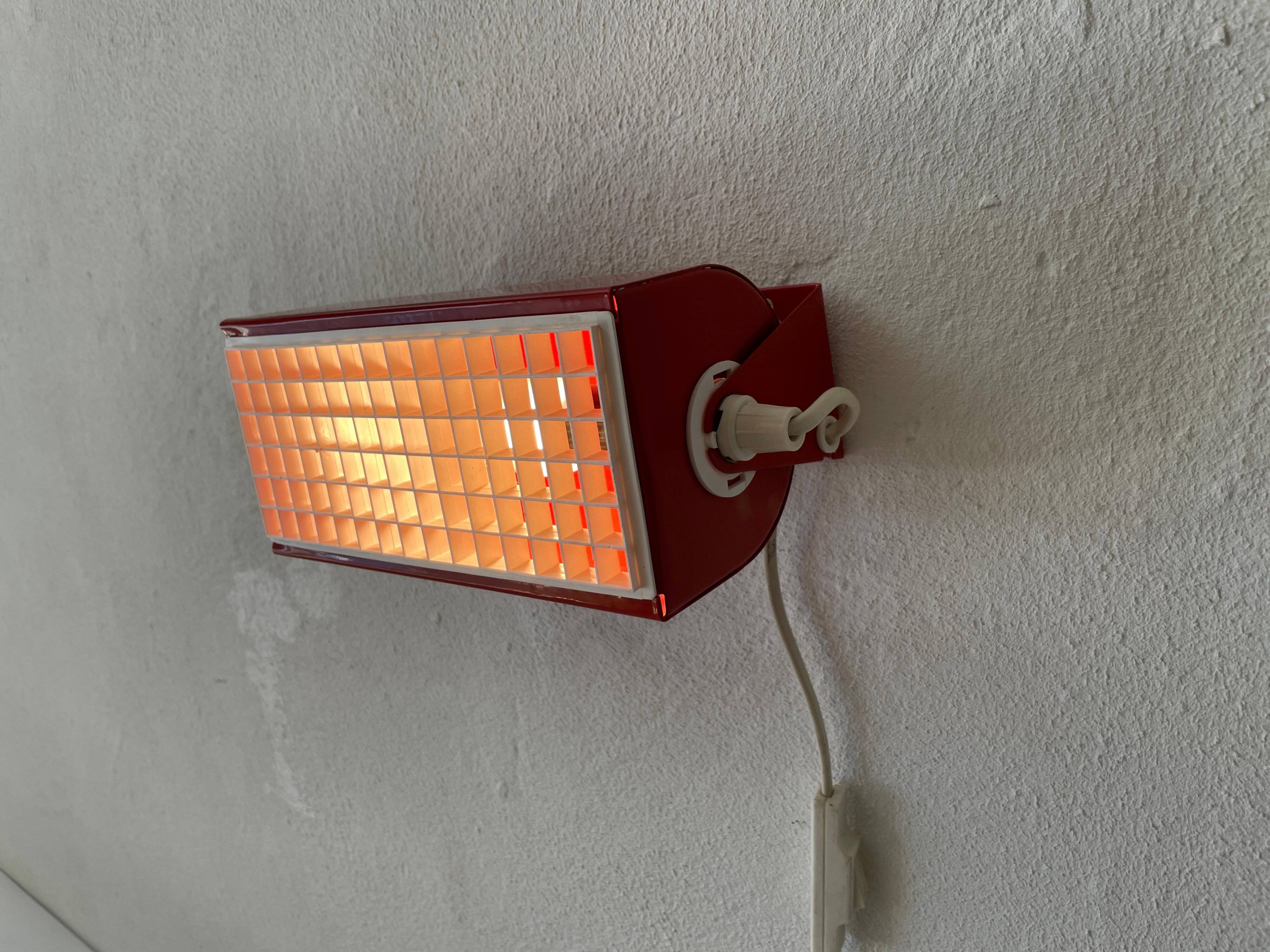 Simple red metal wall light from the AGE, 1970s, Germany.