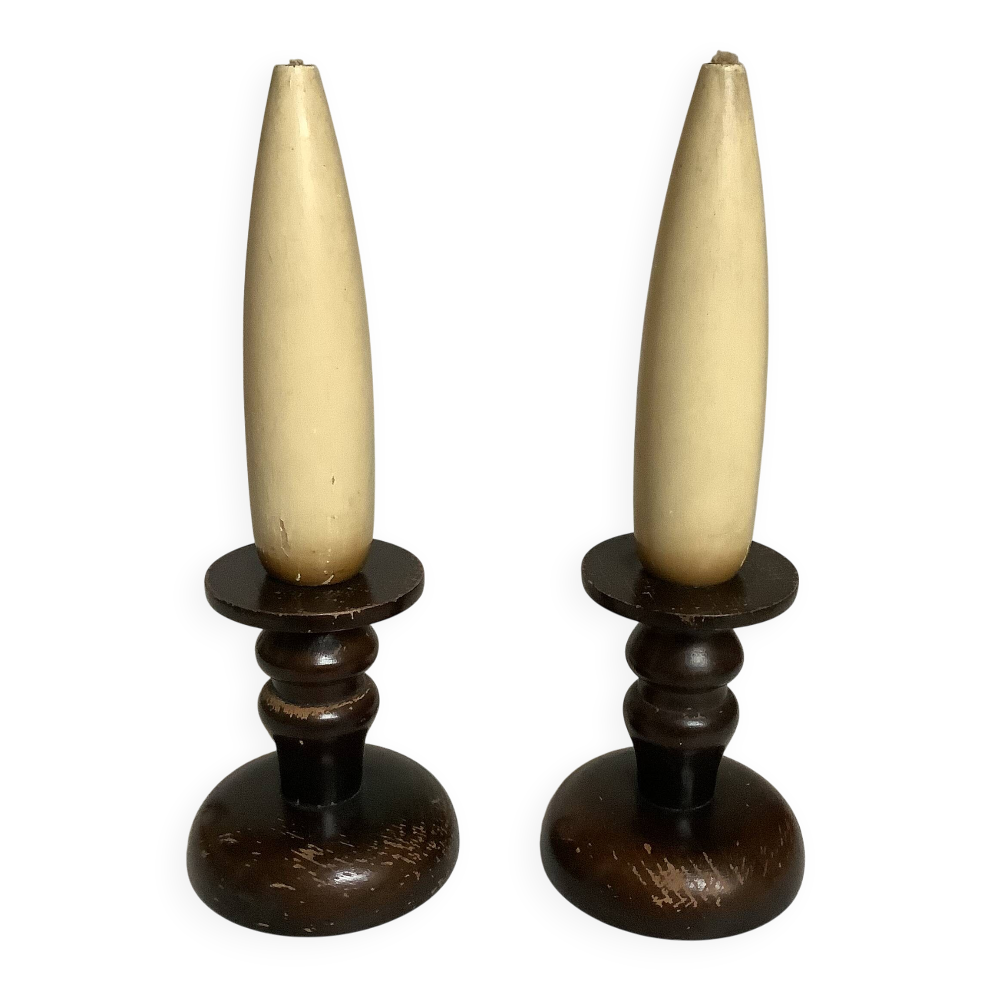 Pair of wooden candlesticks with fake wooden candles.