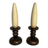 Pair of wooden candlesticks with fake wooden candles.
