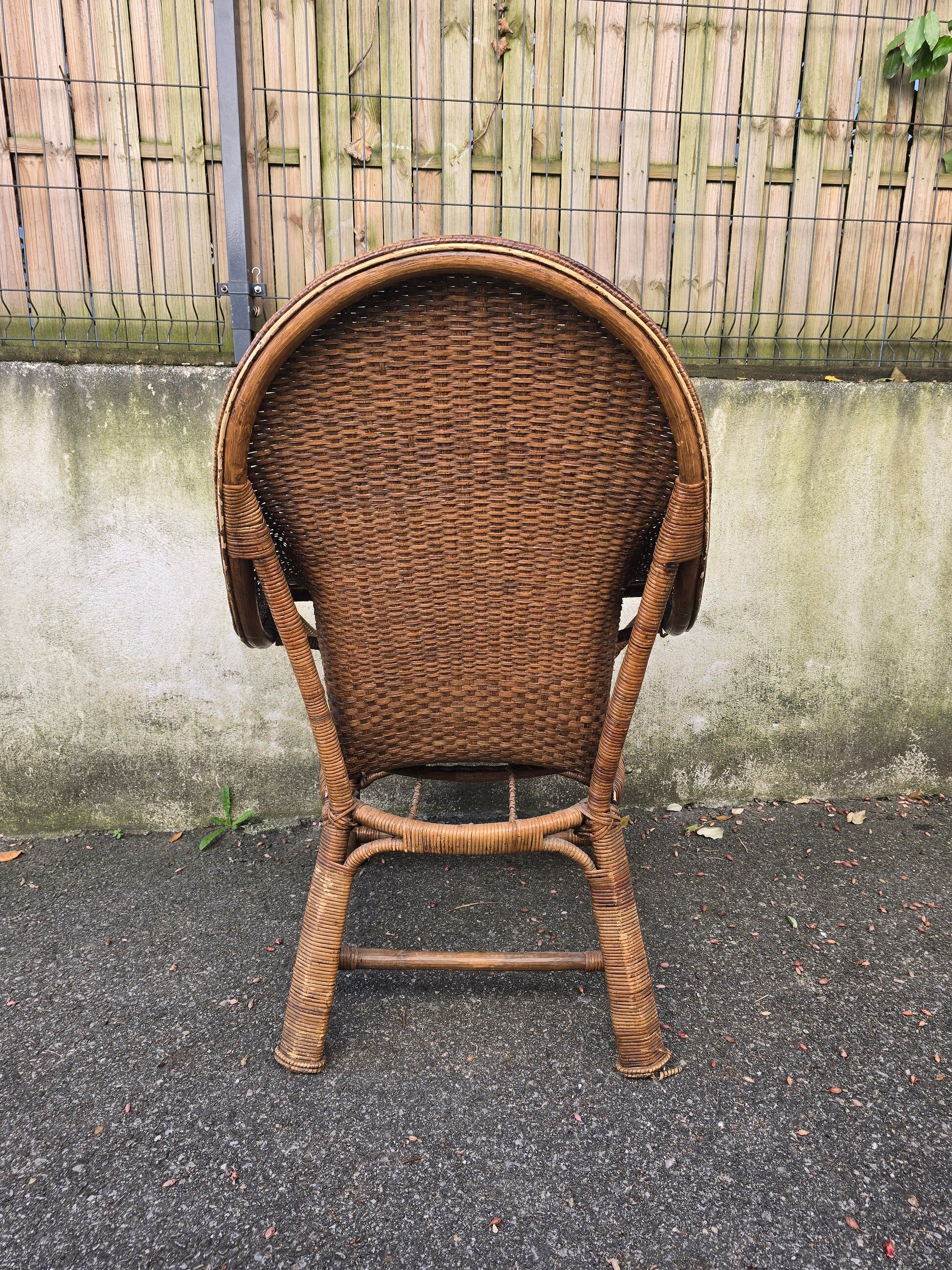 Arts & Crafts armchair in wicker and rattan attributed to Dryad & Co, UK, circa 1920.