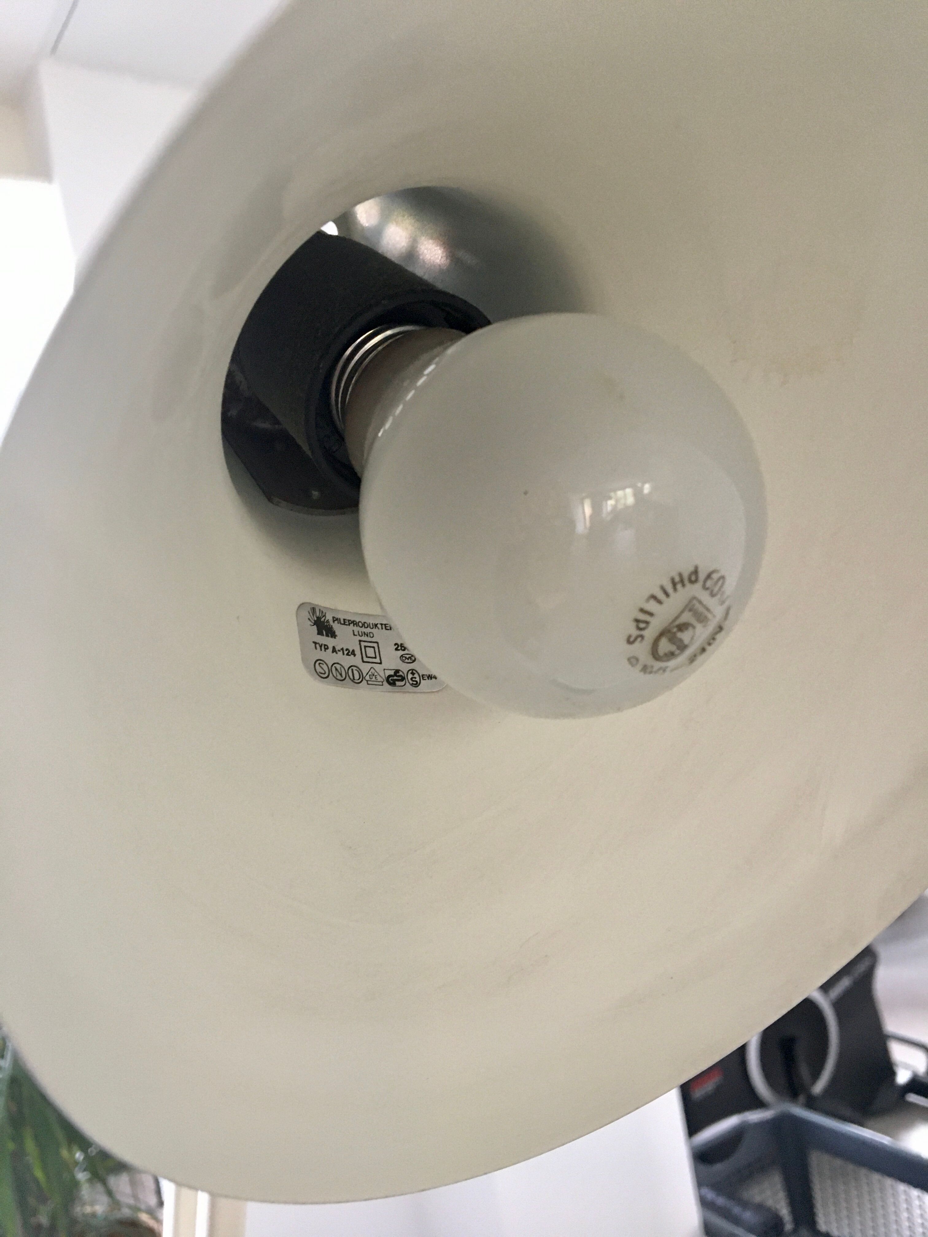 Off-white articulated architect lamp.