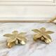 Pair of brass flower candle holders
