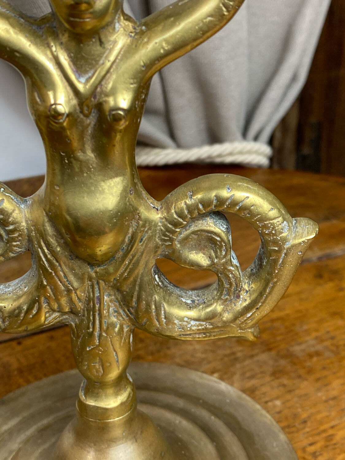 Mermaid-shaped chandelier in bronze