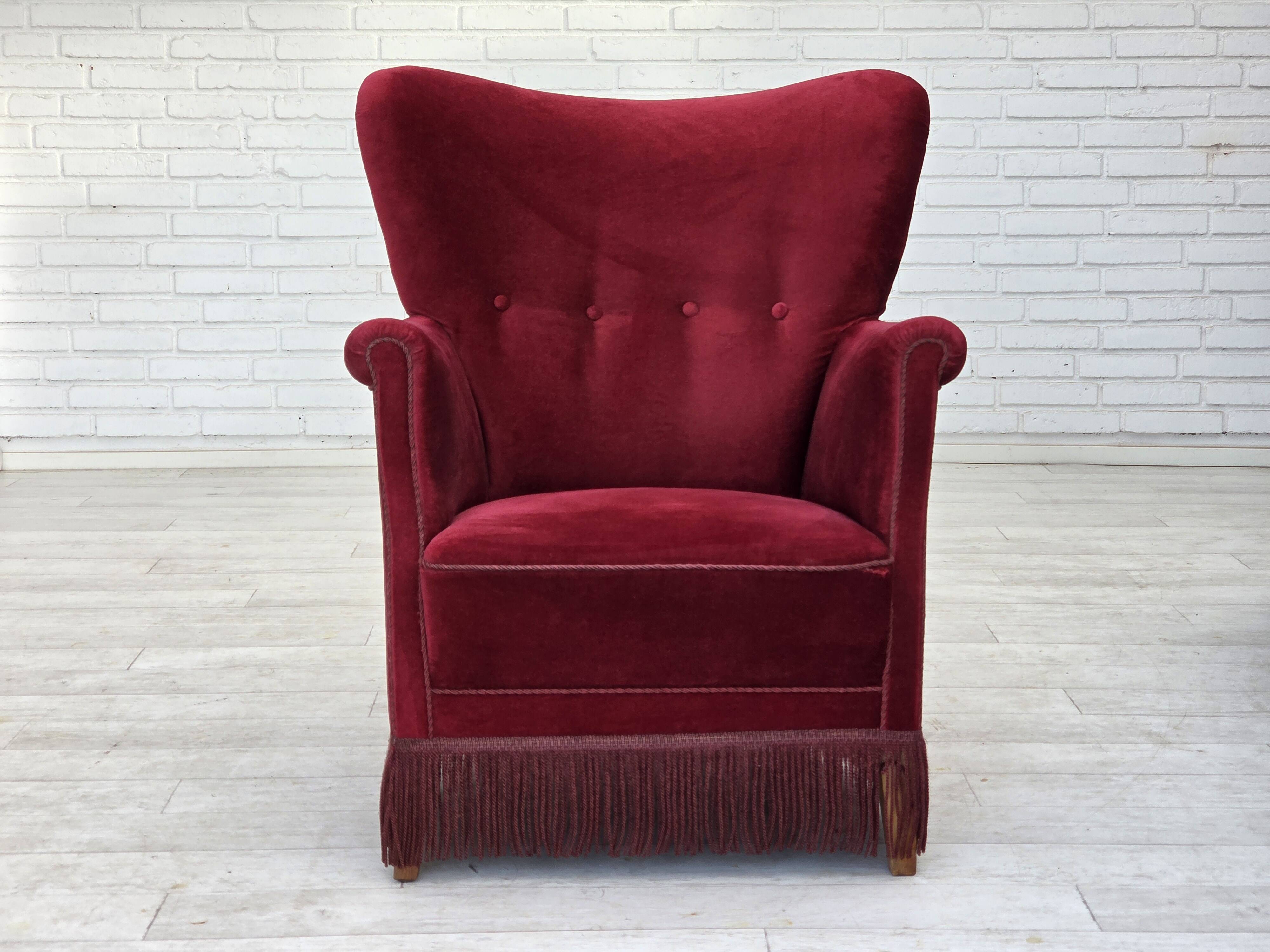 1970s, Danish armchair, cherry-red furniture velour, oak wood legs.