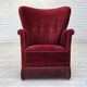Fauteuil danois des années 1970, velours de mobilier rouge cerise, pieds en bois de chêne.