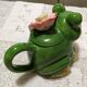 Frog teapot in earthenware with its lid and flowers.